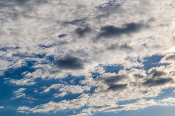 Clouds against the blue sky as a background