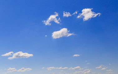Clouds against the blue sky as a background