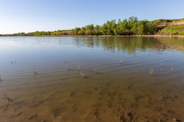 Pond in spring steppe as background