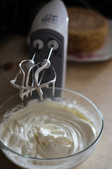 whisking mixer white butter cream to assemble the cake on the occasion