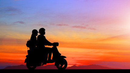 Plakat silhouette of lover couple in sunset with classic motorcycle