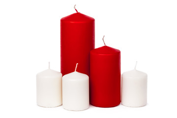 Red and white colored xmas candles isolated on white background