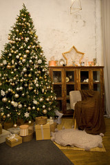 Fototapeta na wymiar Merry Christmas and Happy Holidays! A beautiful living room decorated for Christmas.Interior room decorated in Christmas style. No people. Neutral colors. Home comfort of modern home.