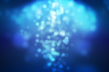 Blue bokeh and soft light falling From top scene setting on dark background