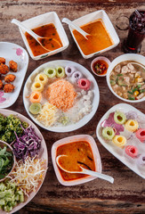Thai rice noodle or vermicelli with various kind of Thai red curry, Top view