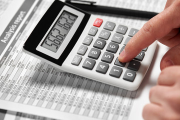 Businessman working and calculating finance. Business financial accounting concept. Closeup hands.