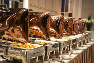 a row of food containers in party