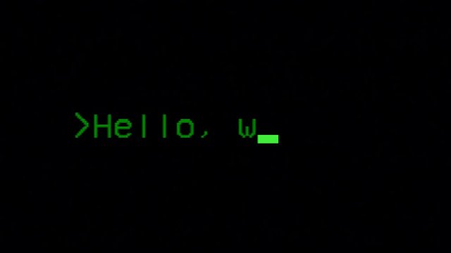 Typing the classical programmers' greeting phrase, Hello World, on a computer terminal. Green characters, black background, clear big font.