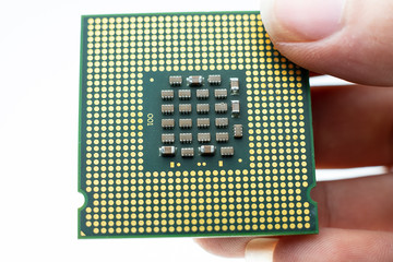 Realistic cpu back view processor chip in hand
