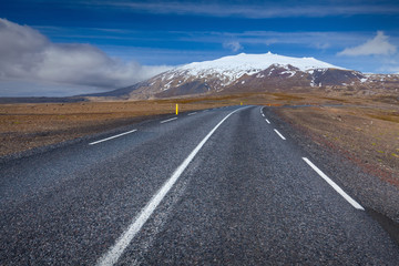 Empty road in west Iceland at sunny day