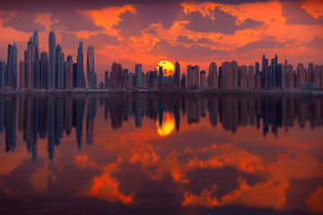 Cityscape of many skyscrapers in Dubai city at popular residential part of town known as Marina and JBR towards idyllic sunrise.