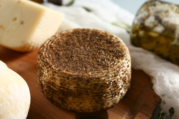 Tasty spicy cheese on table