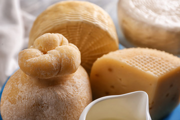 Assortment of tasty cheese on table, closeup