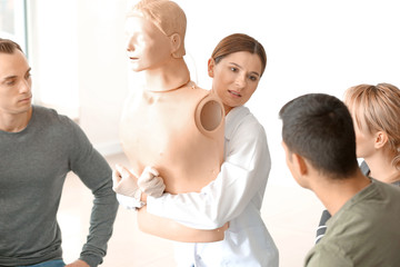 Instructor demonstrating what to do in case of choking at first aid training course