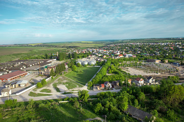 Aerial view of compound plant, fields and farms, rural landscape