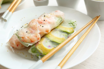 Tasty spring rolls on plate