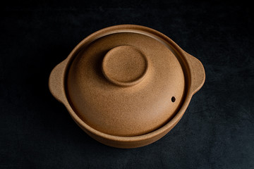 a casserole on a black background