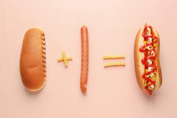 Composition with tasty hot dog on color background
