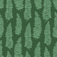green directional ferns on dark green background
