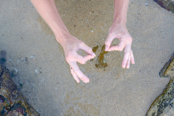 Yoga instructor making some spirit signs 