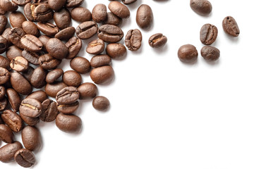 Roasted coffee beans isolated on white background. Close-up.
