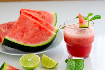 Watermelon smoothie  with lemon and mint to cool down on hot days. Refreshening fruit drink  for hot summer days.