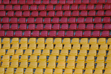 Fototapeta premium Empty seats in the stadium, red and yellow seats