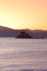 Fototapeta na wymiar Bourtzi the water castle in the middle of Nafplio harbour in Greece