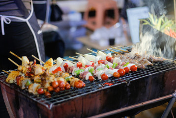 meat on the grill and BBQ skewer on the grill 