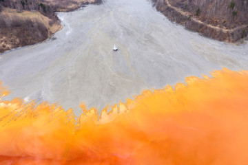 Naklejka premium Aerial view of a submerged church in contaminated lake