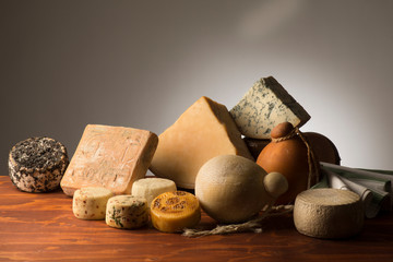 traditional italian cheeses on the wooden table