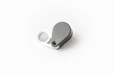 Magnifying glass for diamonds or see the amulet Isolated on a White Background.