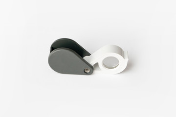 Obraz premium Magnifying glass for diamonds or see the amulet Isolated on a White Background.