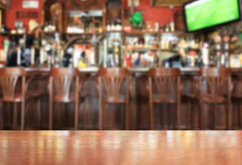 Wooden table on the background of the bar