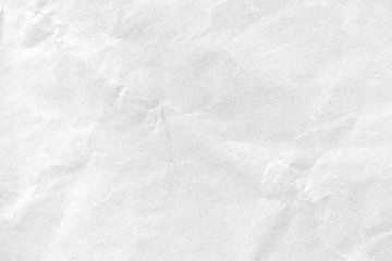 Fototapeta na wymiar White crumpled paper texture background. Close-up.