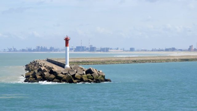 Entrance to the port of Dunkerque with an oil refinery in background