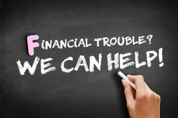 Financial Trouble? We can help! text on blackboard, business concept background