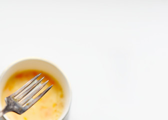 ingredients for making an omelet on a white background