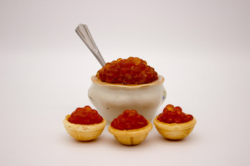 Luxury Red Caviar in the bowl. Food photo concept.