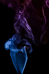 Blue smoke on black background