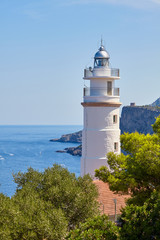 Fototapeta na wymiar Cap Gros lighthouse located on a cliff in the vicinity of Port Soller, Mallorca, Spain.