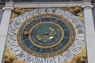 Clock tower with historical astronomical clock at Piazza Loggia, Brescia, Lombardy, Italy.