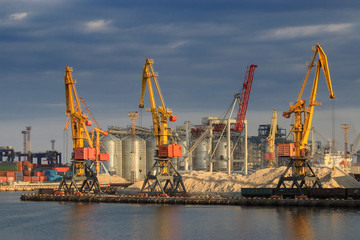 Lifting cargo cranes, ships and grain dryer in Sea Port of Odessa, Black Sea, Ukraine - obrazy, fototapety, plakaty