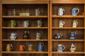 old tea pot in the brown wood shelf