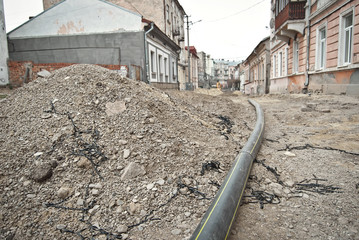 The street of the city is torn down. Construction and laying of pipelines and sewerage. Chernivtsi,...
