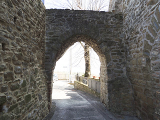 Fototapeta na wymiar Medieval gate of Civitella Benazzone, a small ancient village near Perugia in Umbria, Italy.