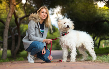 Young girl with her dog in a park