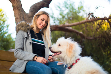 Young girl with her dog in a park