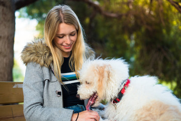 Young girl with her dog in a park