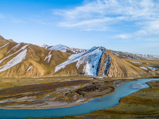 River and Snow Mountain Background on Bayanbrook Grassland, Xinjiang, China 